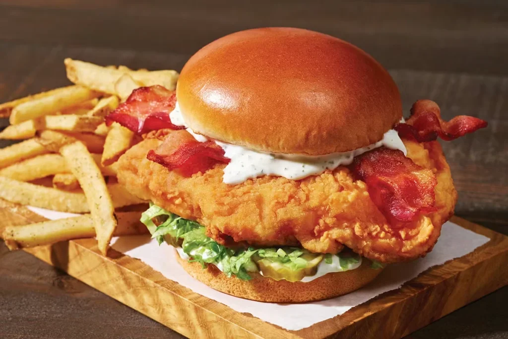 Crispy chicken burger with fries.