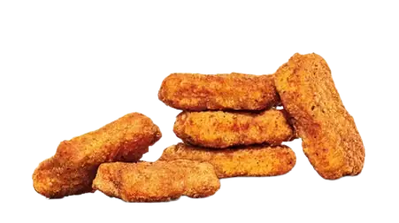 A pile of crispy, golden-brown chicken nuggets against a white background.