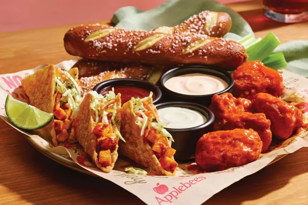 Applebee’s appetizer platter with boneless wings, soft pretzels