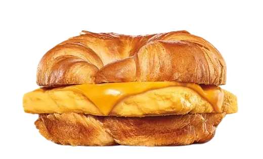 A vegetarian breakfast croissant sandwich showing only a thick layer of folded egg and melted cheese.