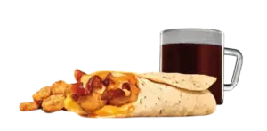 A loaded breakfast burrito filled with cheese and bacon, served next to crispy hashbrowns and a cup of black coffee.