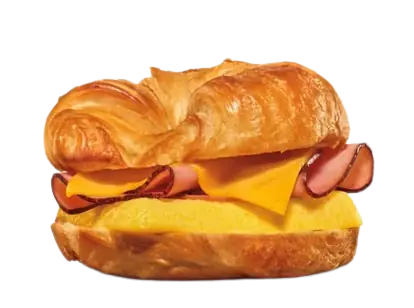A breakfast croissant sandwich featuring crisp strips of bacon, a folded egg sheet, and melted cheese.
