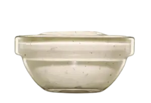 A small clear glass bowl filled with yellow honey mustard dipping sauce.