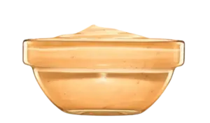 A small clear glass bowl filled with creamy orange zesty dipping sauce.