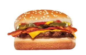 Beef burger topped with melted cheese, crispy bacon slices, pickles, and sauce.