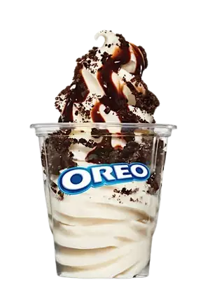 Vanilla soft serve sundae with chocolate drizzle and crushed OREO cookies in a cup, referencing OREO-Sundae-allmenuprices.webp.